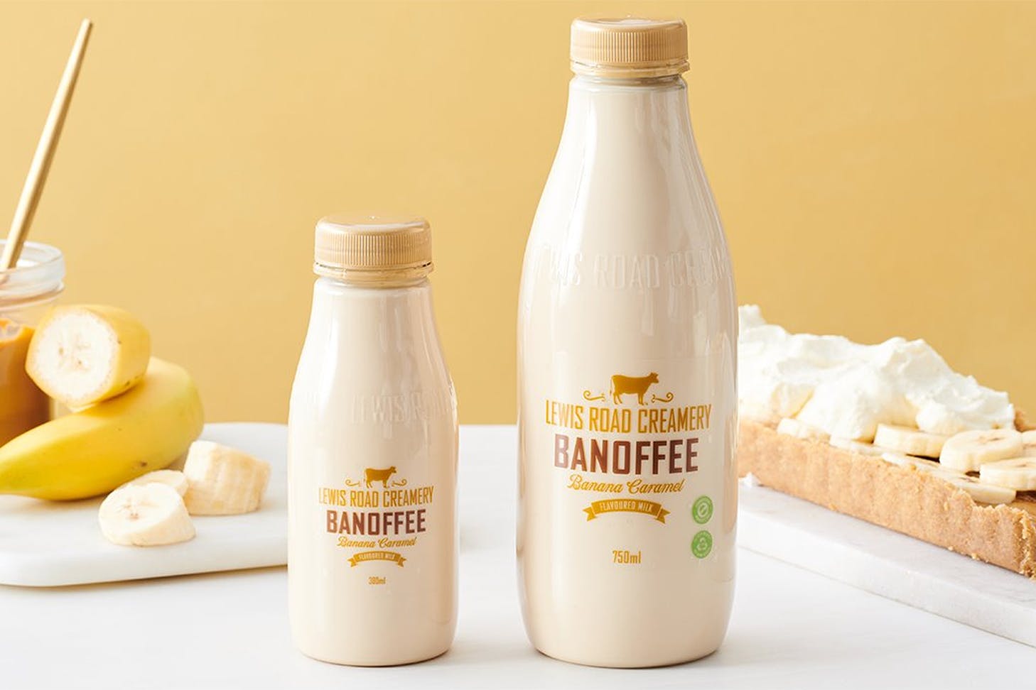 Lewis Road Creamery's new Banoffee flavoured milk with banana and caramel in the background.
